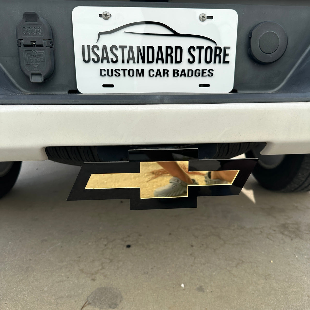 Chevy Bowtie trailer hitch cover emblem in gold and black finish
