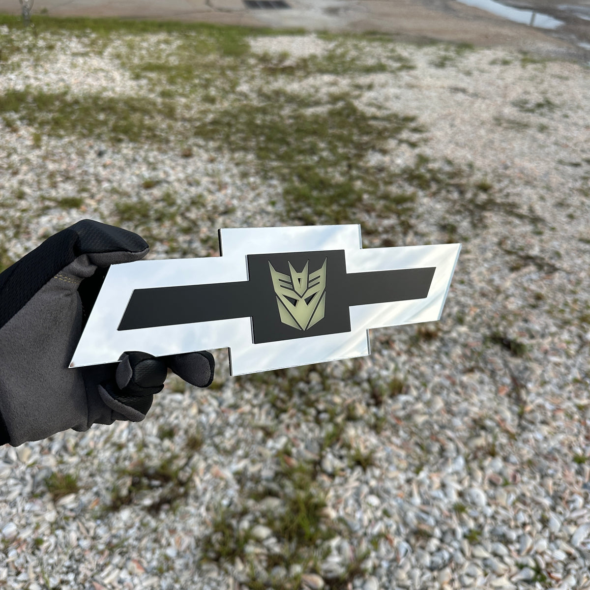 Chevrolet Bowtie silver emblem with centered glow Decepticon graphic