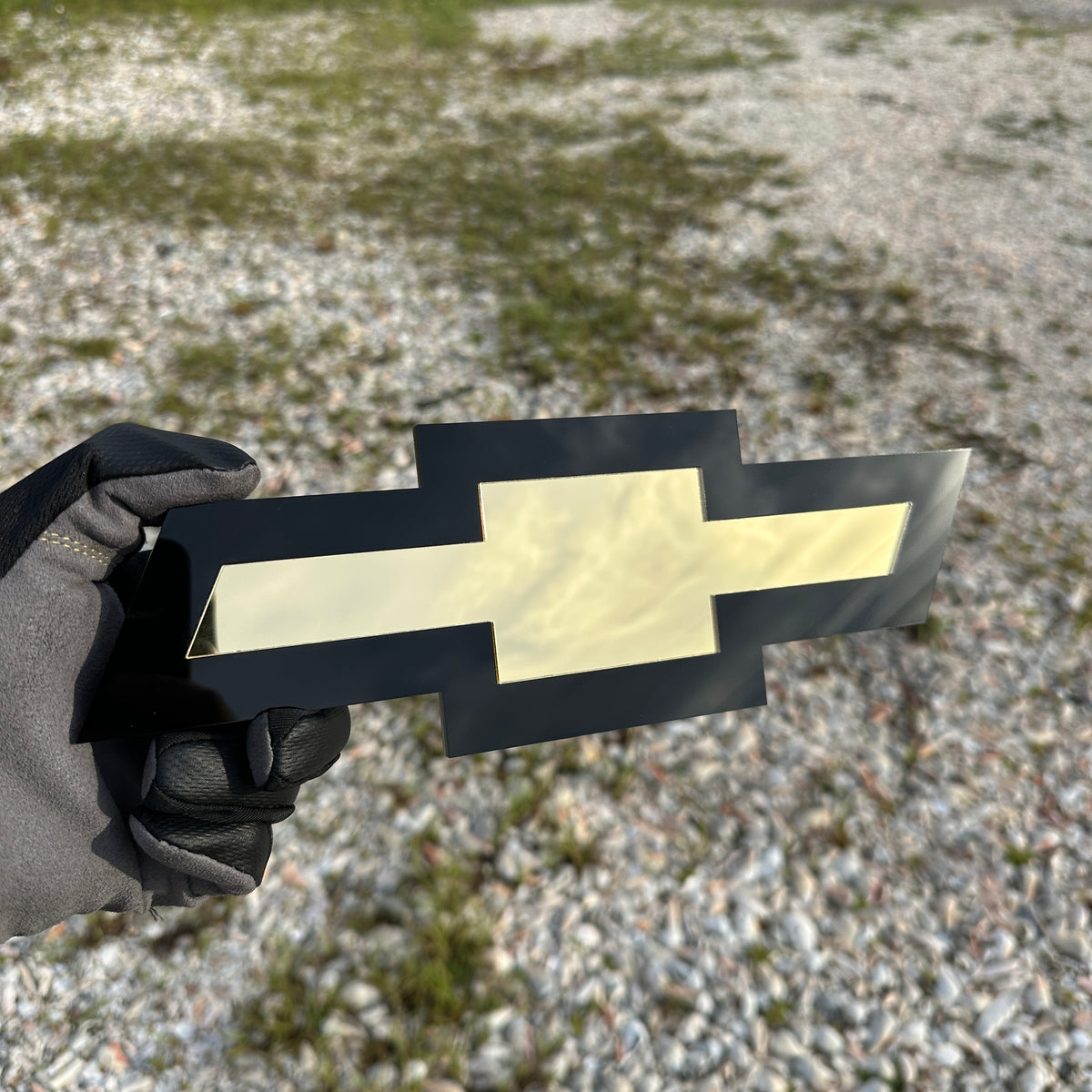 Chevrolet Bowtie emblem with black outer layer and gold center