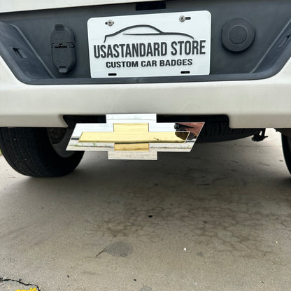 Chevrolet receiver hitch cover with gold Bowtie center and silver border