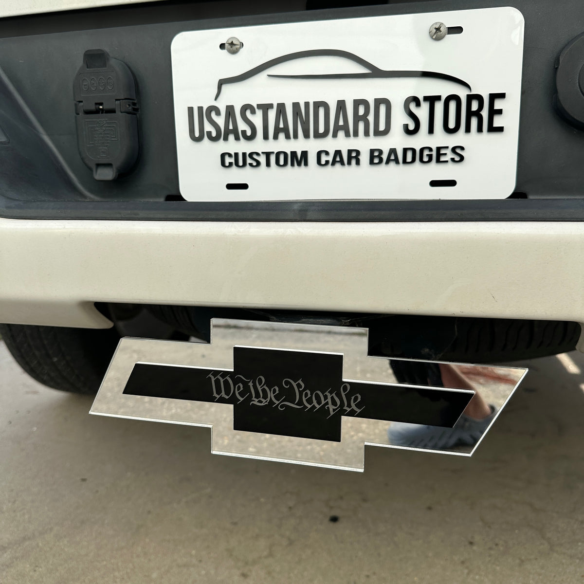 Chevrolet Bowtie hitch emblem featuring We the People text on black center