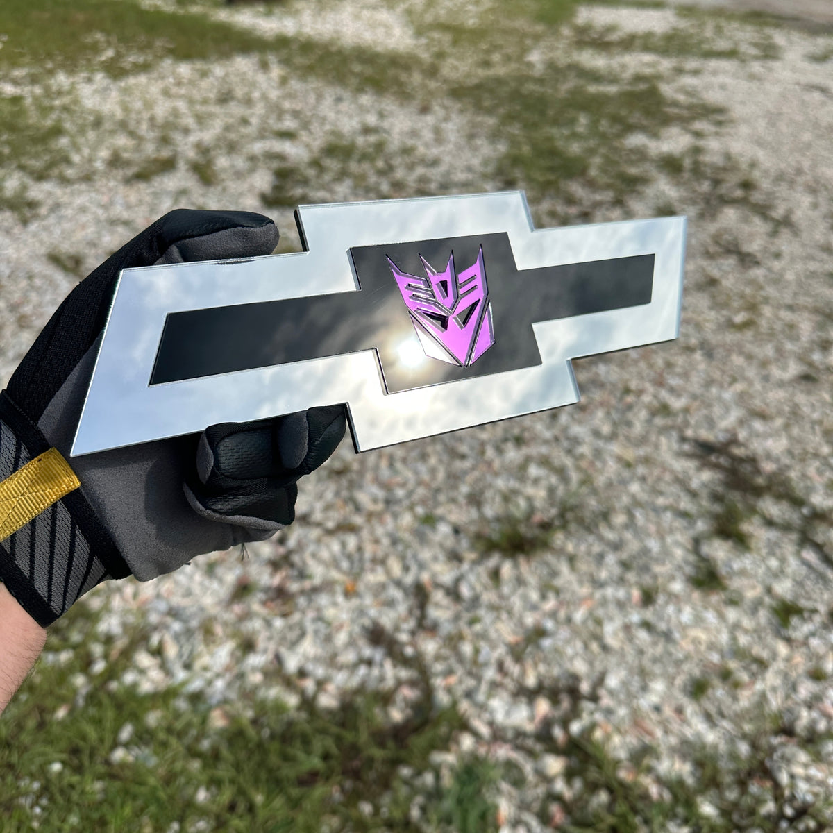 Silver Chevy Bowtie badge with mirror purple Decepticon symbol