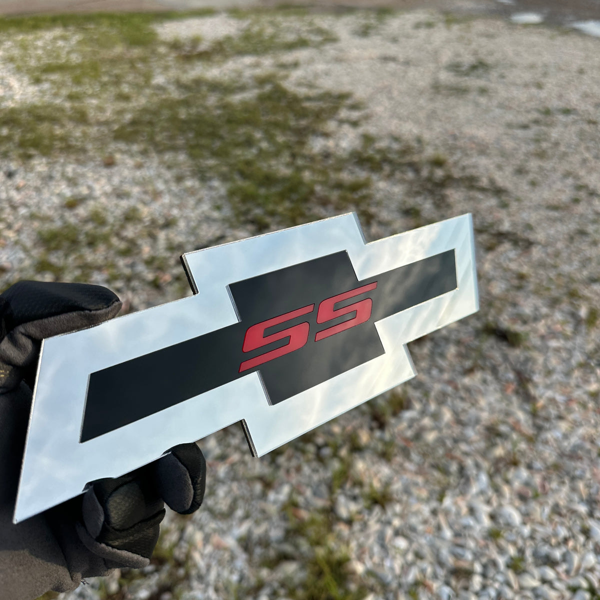 Chevy Bowtie SS automotive emblem with black center stripe