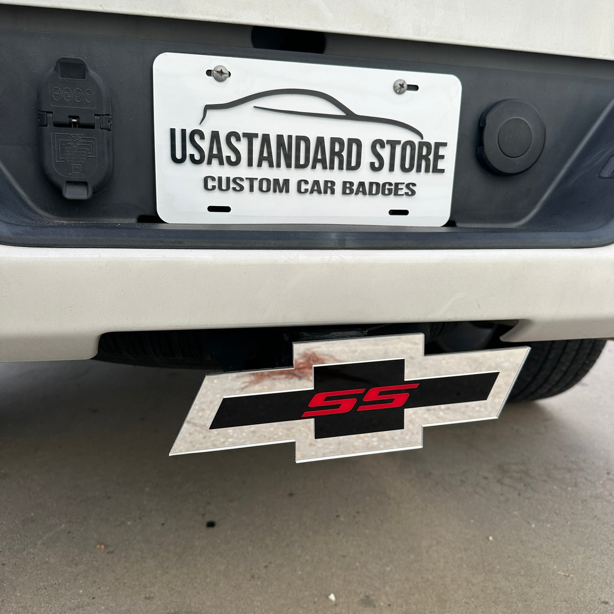 Chevy Bowtie SS hitch cover with silver outer finish, black center, and red SS emblem