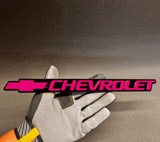 Chevy Bowtie rear tailgate emblem in red and black for 1999-2006 Chevrolet.