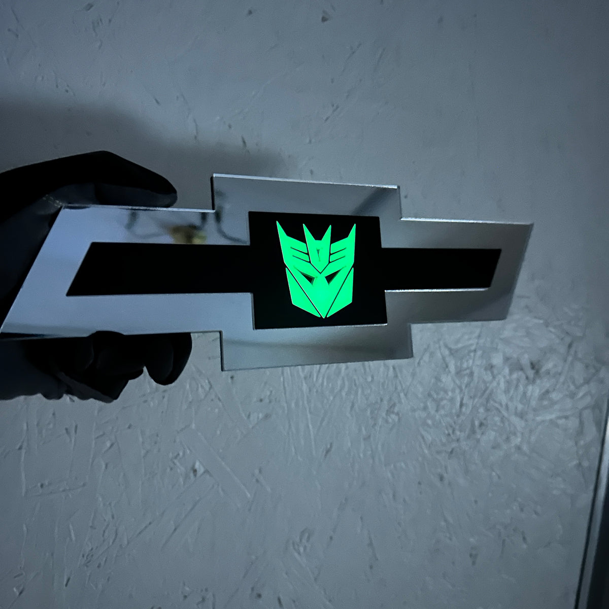 Chevrolet car badge in silver with Decepticon glow center design