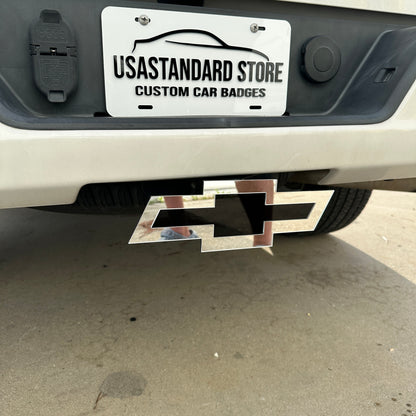 Mirror silver Chevy Bowtie hitch cover with black center insert and clean outline
