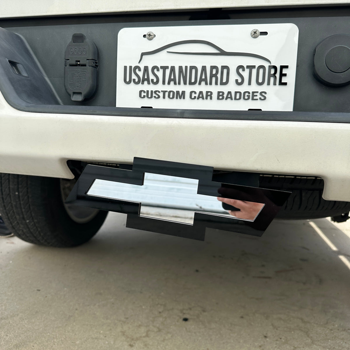 Chevrolet truck hitch emblem with silver Bowtie face and black outline
