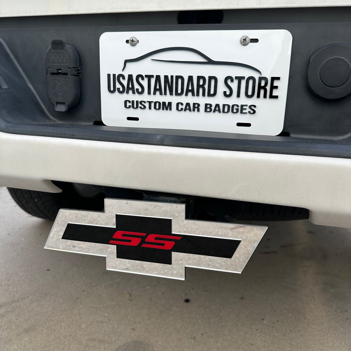 Chevy SS truck hitch cover featuring a red SS emblem on black and silver Bowtie design
