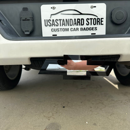 Silver Chevrolet Bowtie receiver hitch cover with black acrylic backing