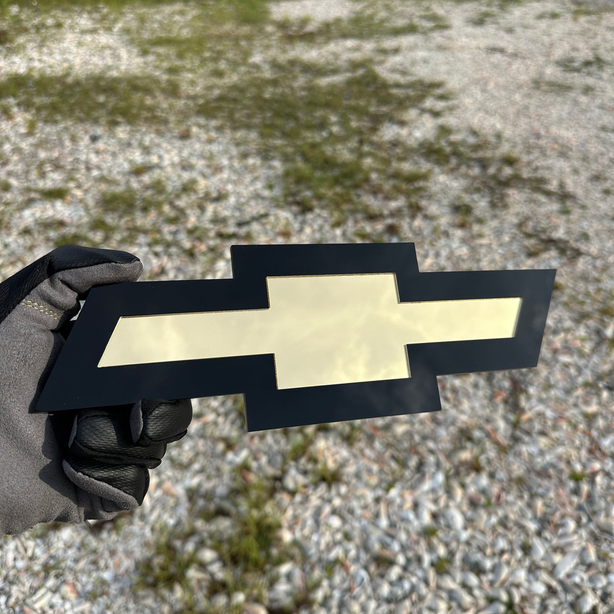 Chevy Bowtie car badge in black and gold finish