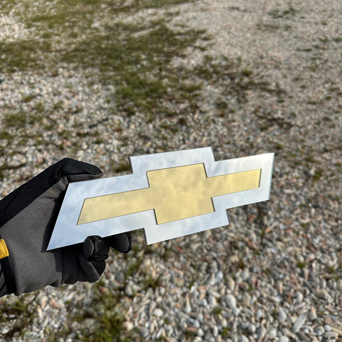 Chevrolet Bowtie emblem in reflective silver and gold finish