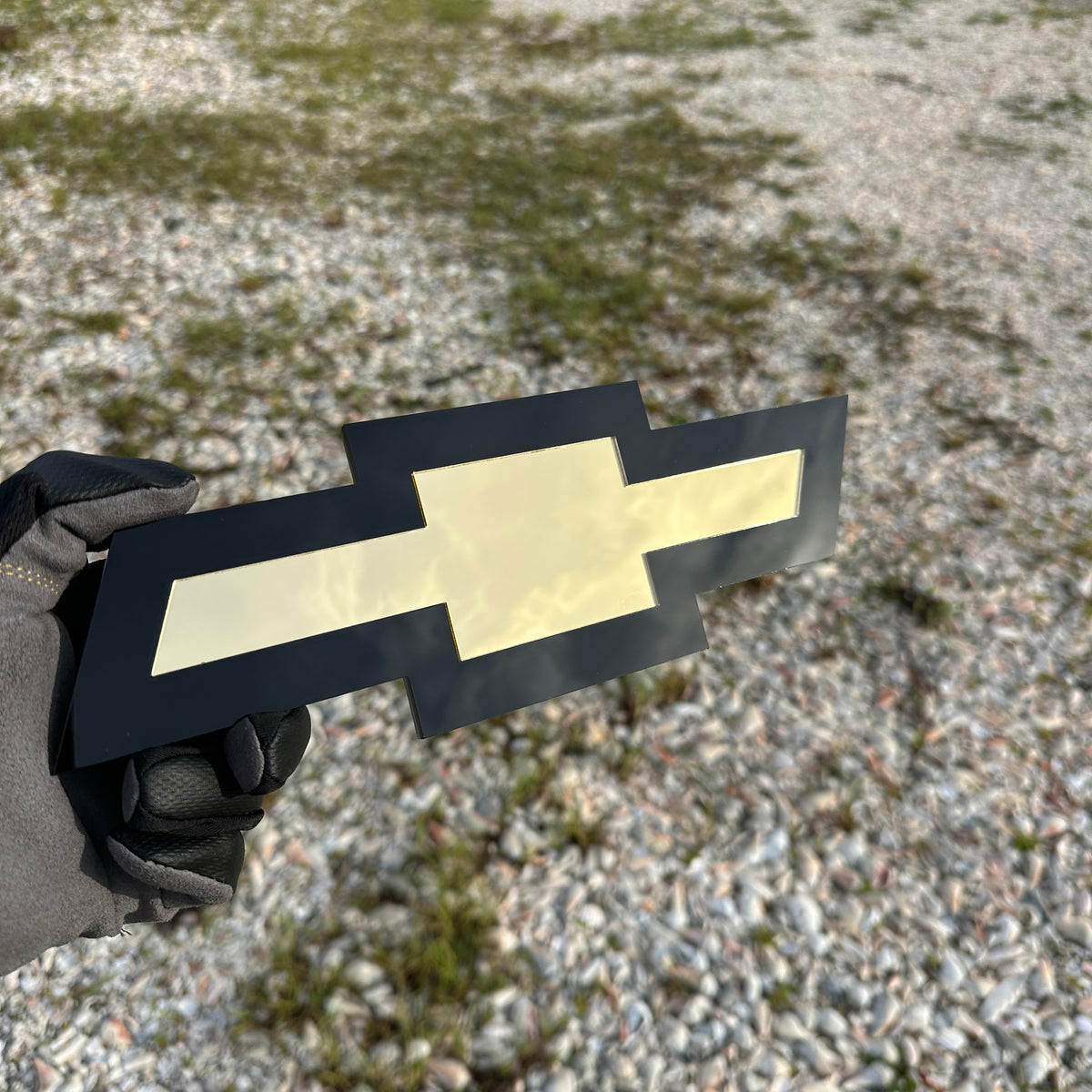 Custom Chevy Bowtie car badge with black base and gold insert