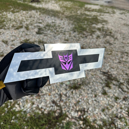 Chevrolet Bowtie emblem featuring a mirror purple Decepticon logo on black center