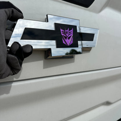 Chevy Decepticon Bowtie automotive emblem with reflective purple detail