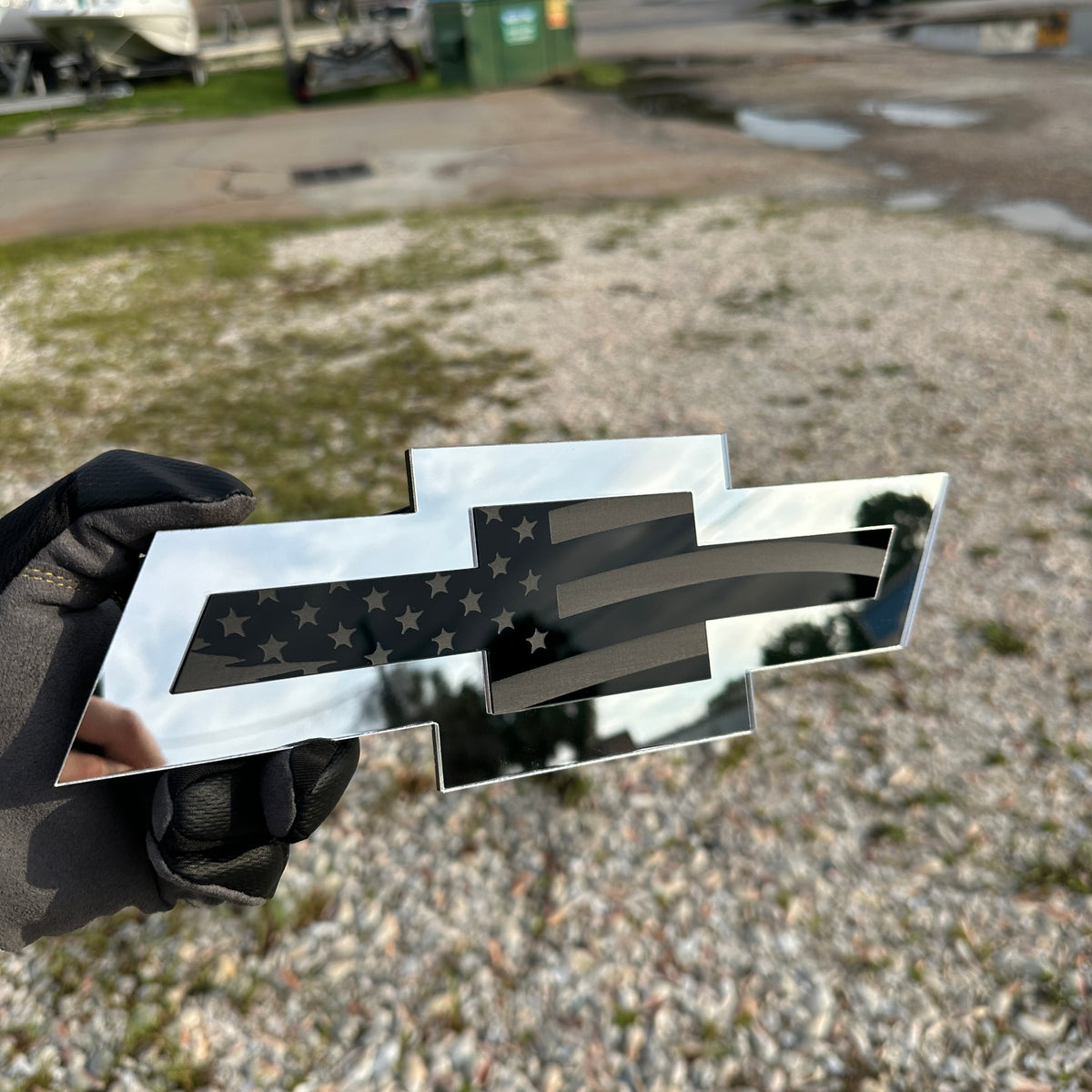 Silver Chevy Bowtie badge with black American flag engraving for vehicle exterior