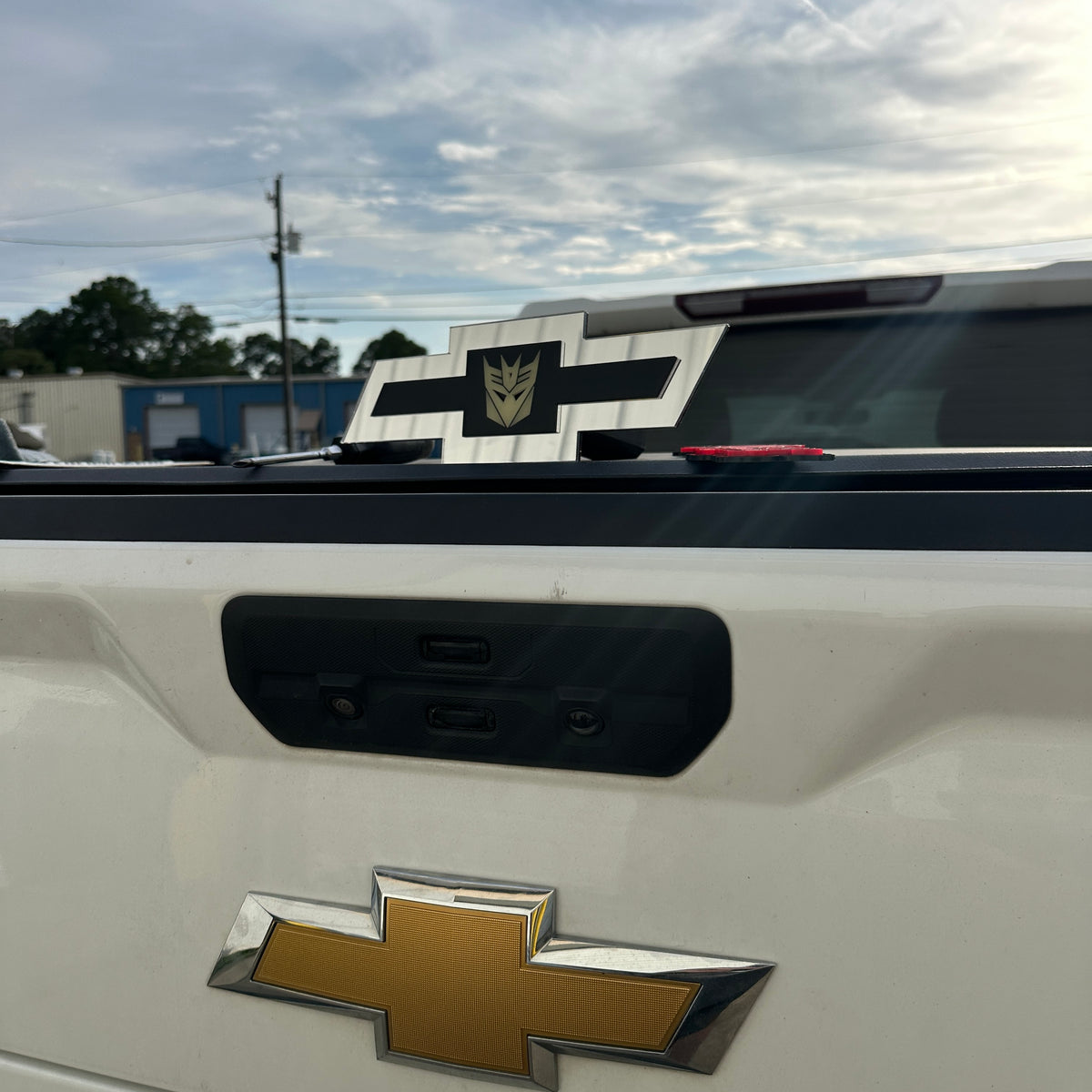 Chevy Bowtie exterior badge in silver with black stripe and glow Decepticon emblem