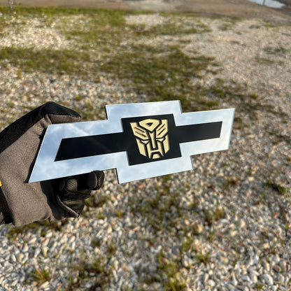 Chevy Autobot Bowtie car emblem in silver black and gold layered design