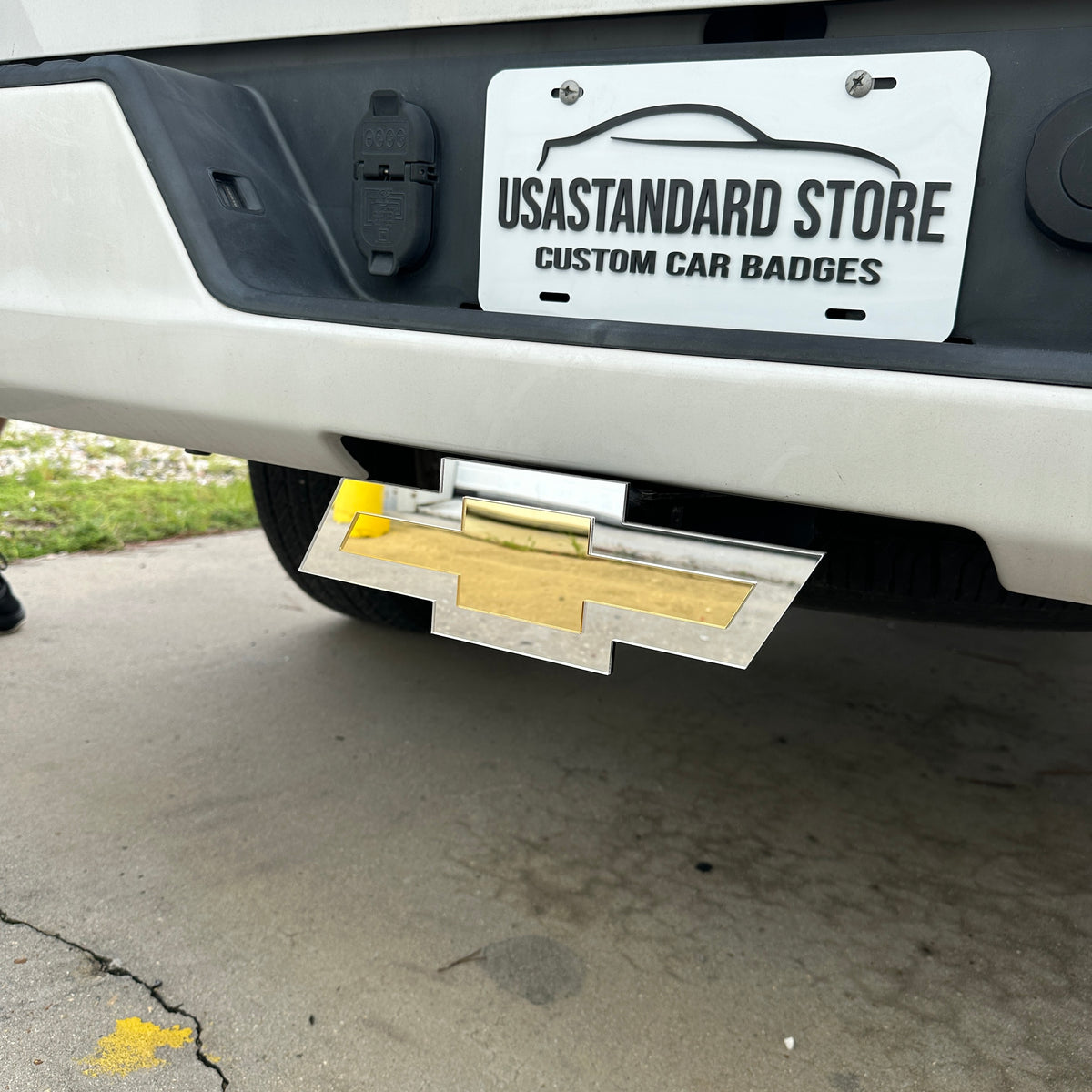 Chevy truck hitch cover featuring silver and gold Bowtie emblem design