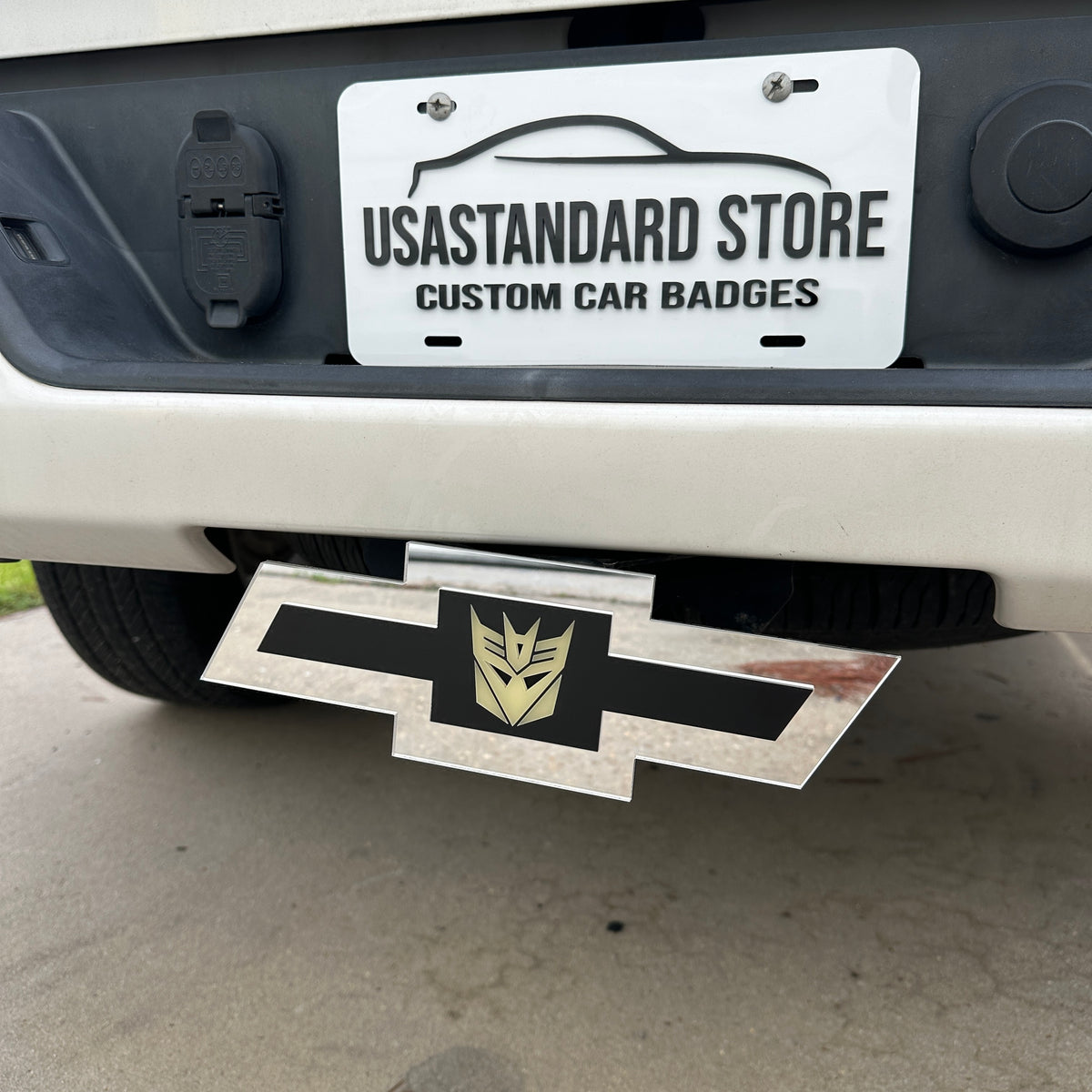Silver Chevrolet Bowtie Decepticon truck hitch cover for rear receiver