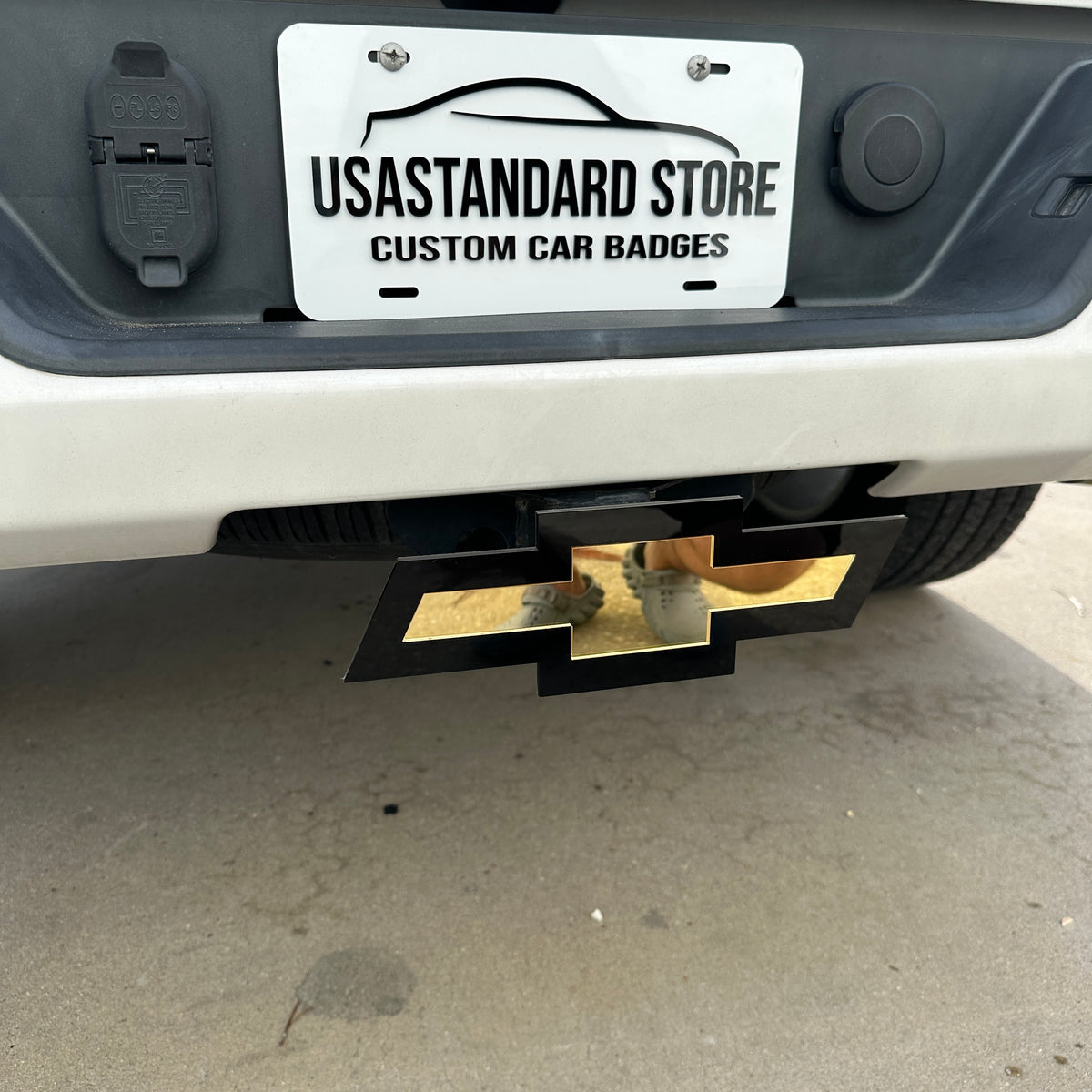 Chevrolet Bowtie car badge style hitch cover with mirror gold face