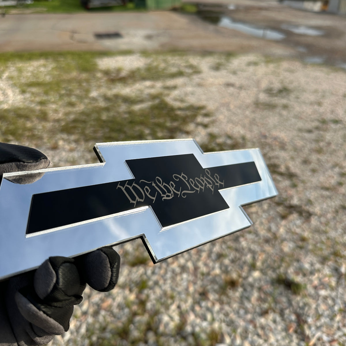 Chevrolet Bowtie hitch cover with silver finish and gold Autobot logo center