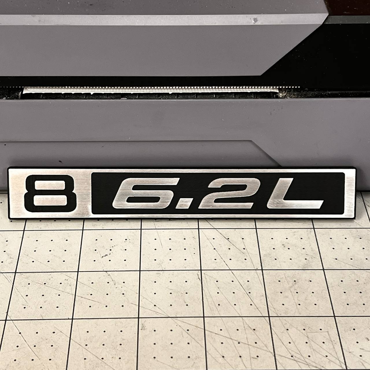 Custom silver billet 6.2L front fender emblem for 1967-1972 Chevy C10 truck.