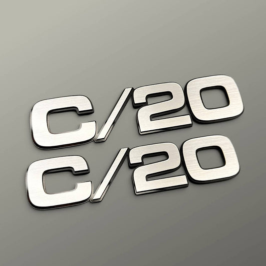 Chevy C/20 truck fender badge with brushed billet look and black outline