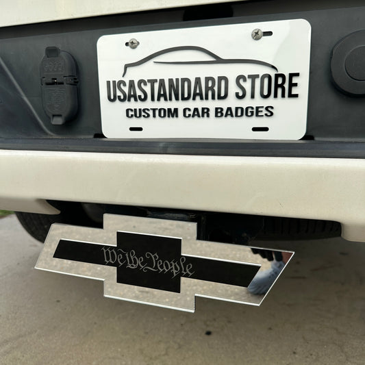 We the People Chevy Bowtie hitch cover mounted on rear truck receiver