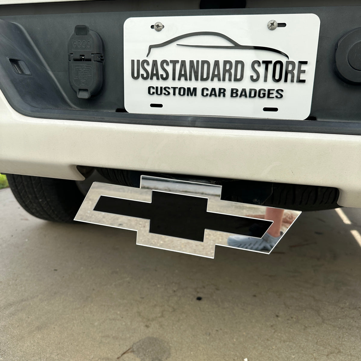 Custom Chevrolet Bowtie hitch emblem in silver and black for truck exterior