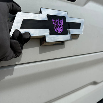 Silver and black Chevy Bowtie badge with mirror purple Decepticon center