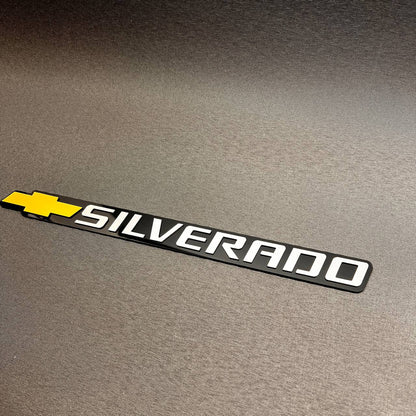 Silverado truck tailgate emblem with gold Chevy bowtie and premium layered design.