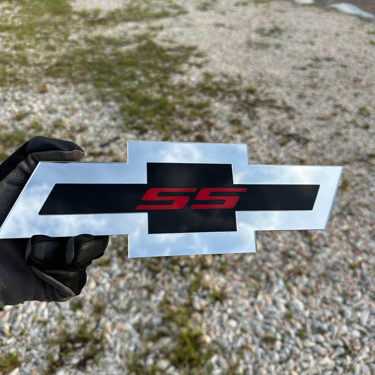 Chevy Bowtie SS car badge in silver, black, and red finish