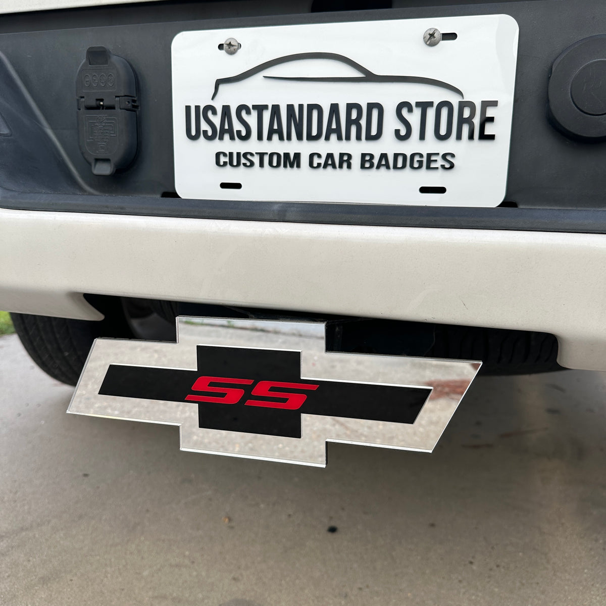 Silver Chevy Bowtie SS hitch cover with black center and red lettering