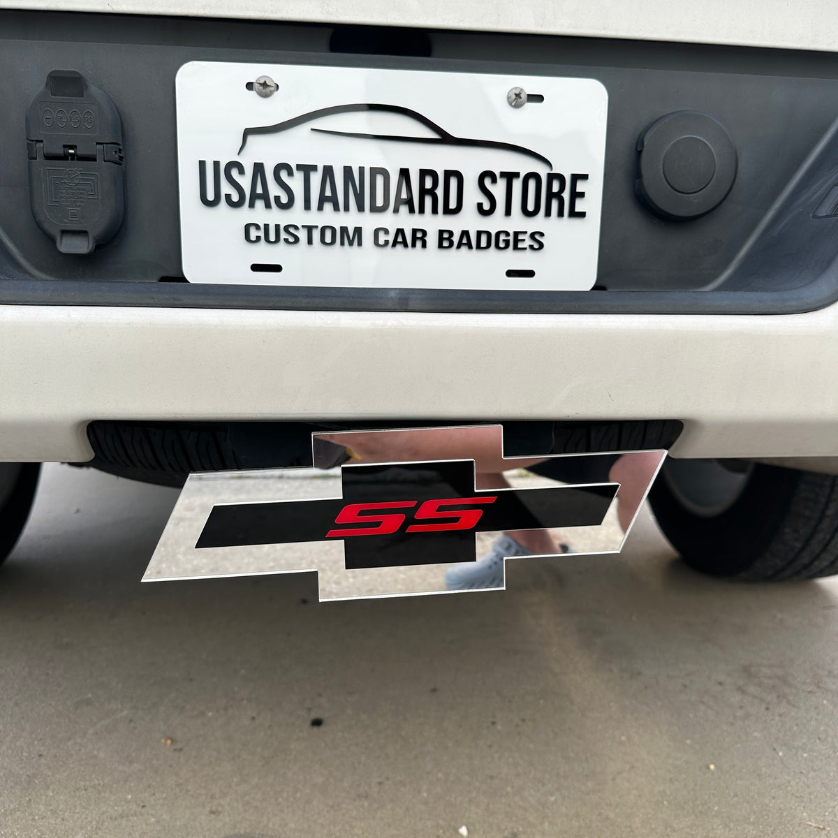 Custom Chevy Bowtie SS hitch cover with layered silver, black, and red design