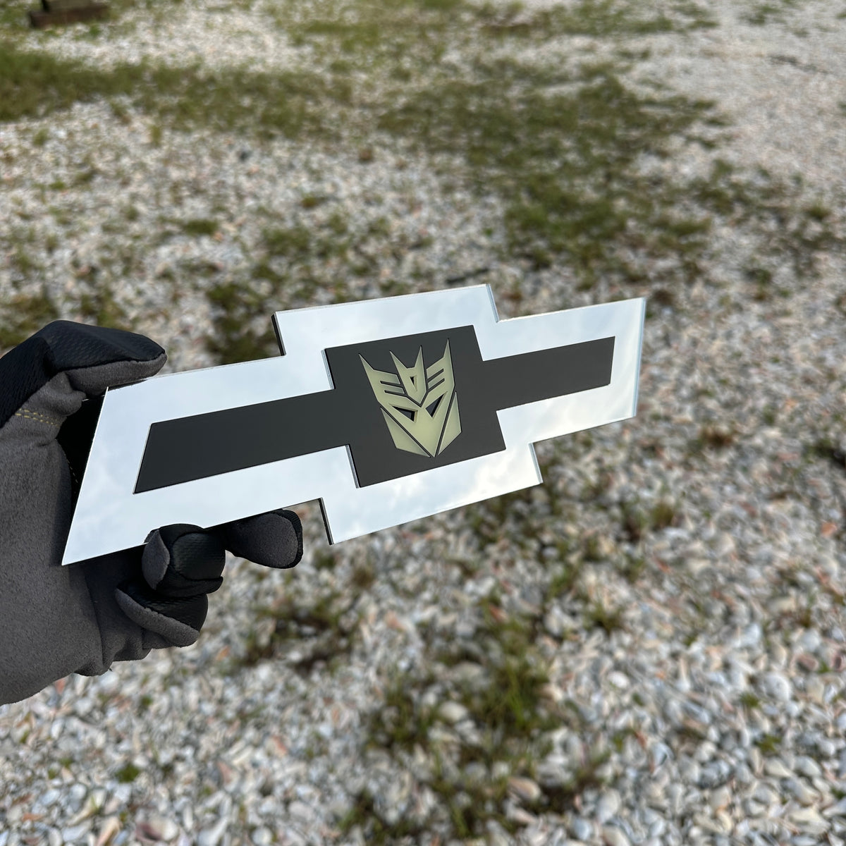 Silver Chevy Bowtie custom badge with black center and Decepticon logo