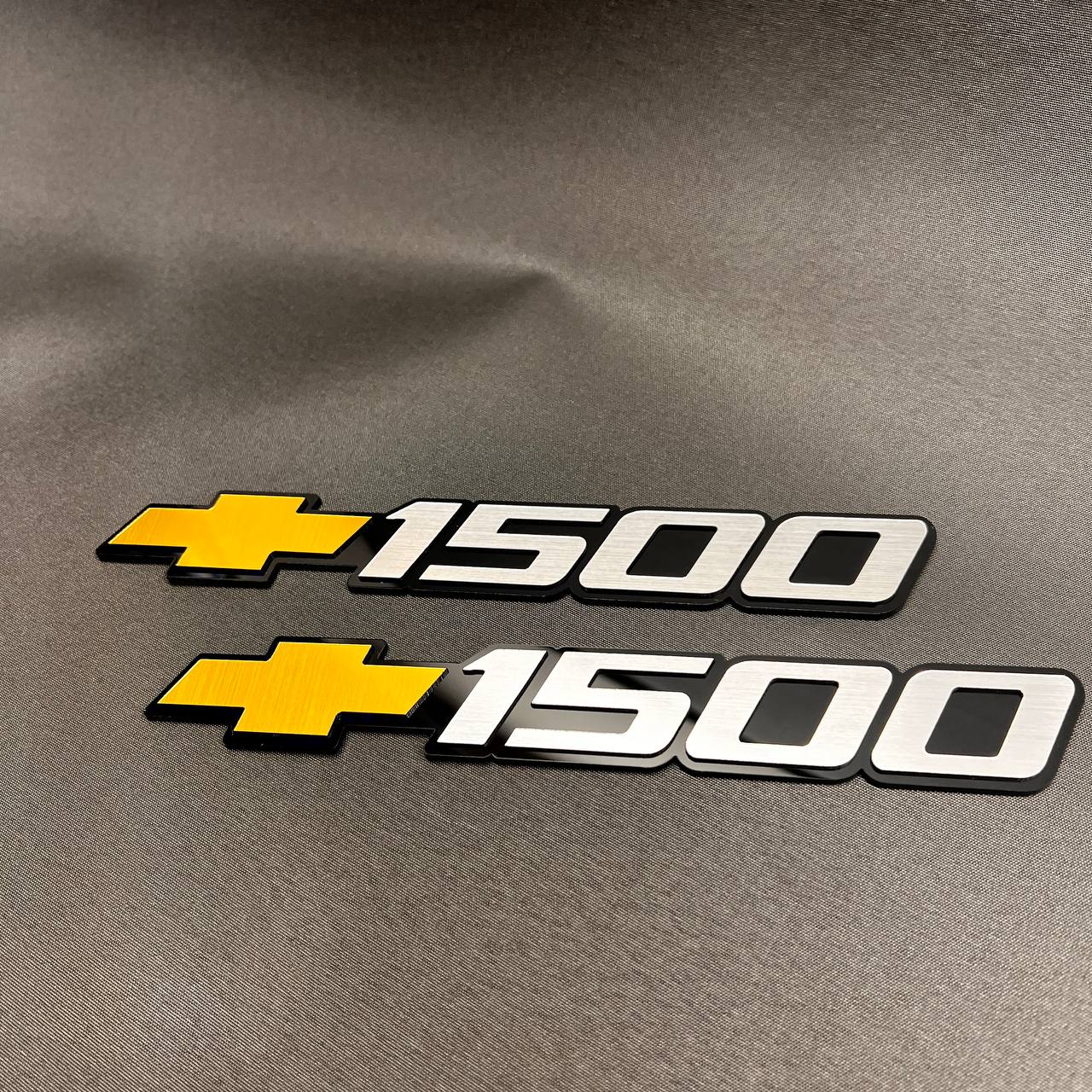 Custom Chevy 1500 door badge set with black base, silver letters, and gold bowtie
