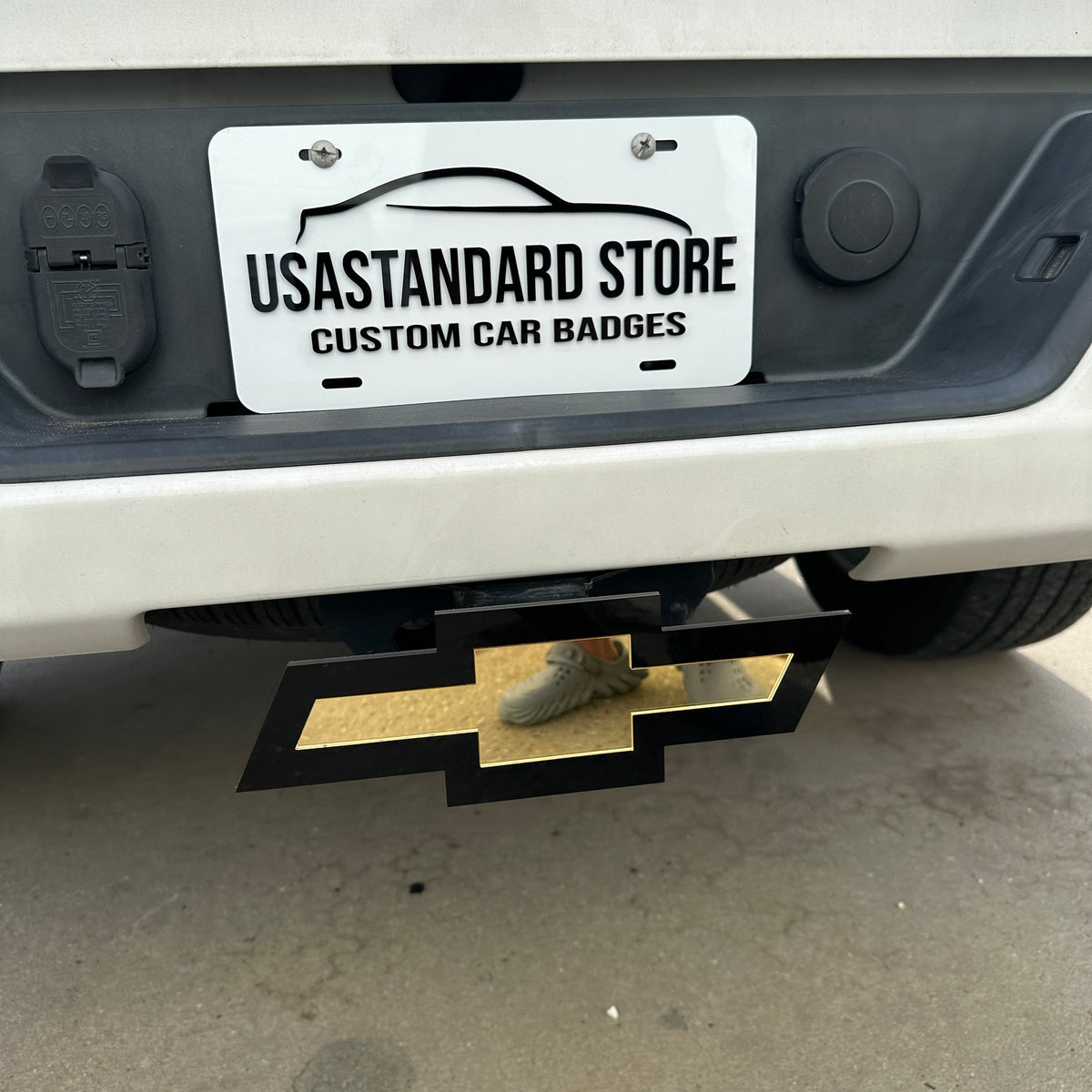 Custom Chevy Bowtie hitch cover with gold emblem and black outline