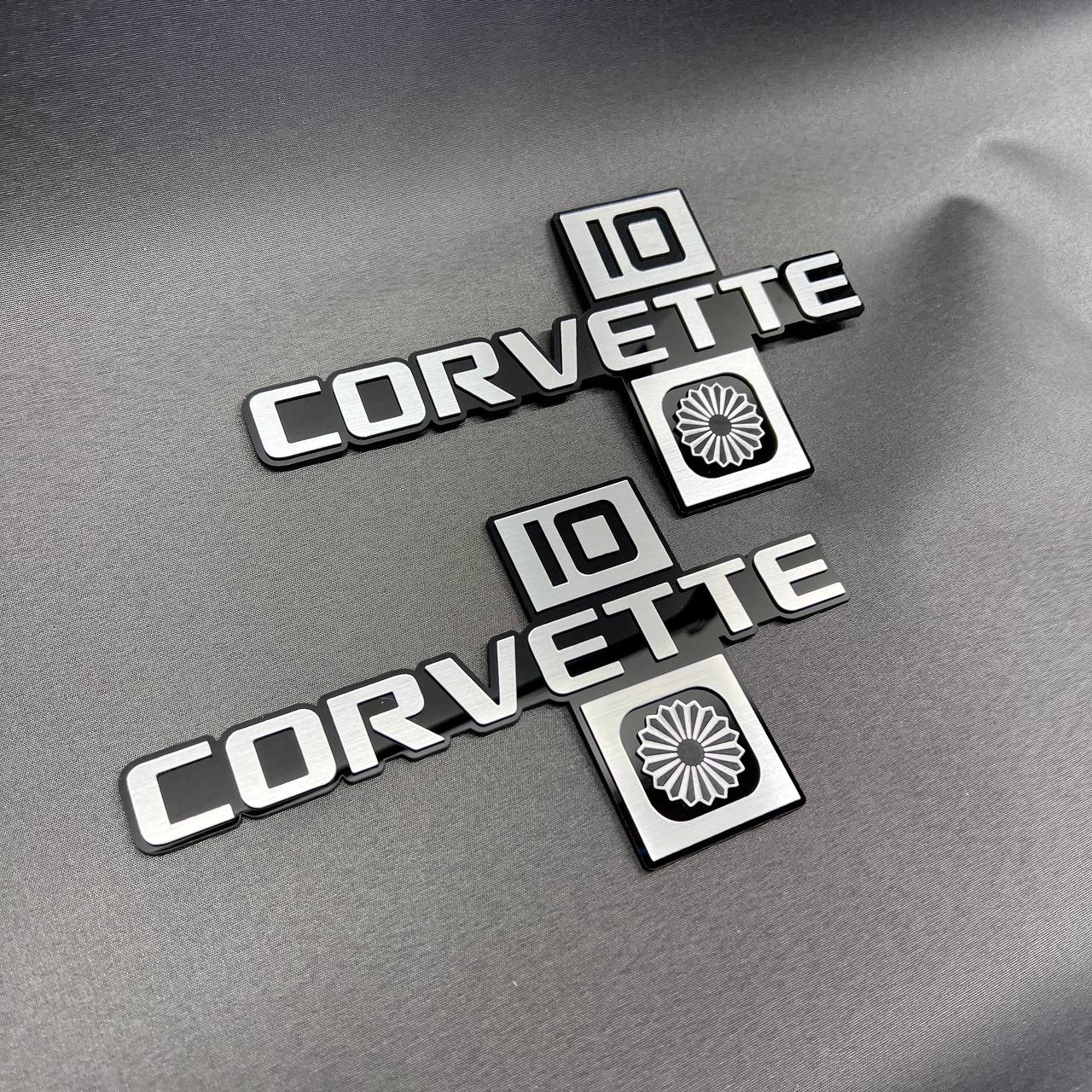Close-up of Corvette C10 Collector Edition Chevrolet emblem with premium layered design.