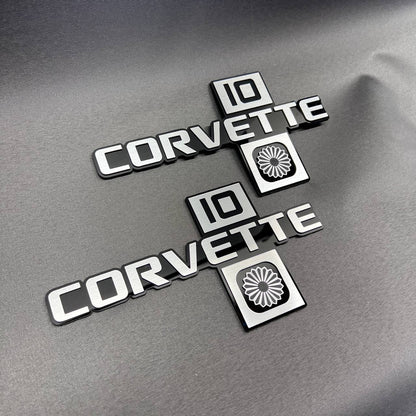 Close-up of Corvette C10 Collector Edition Chevrolet emblem with premium layered design.