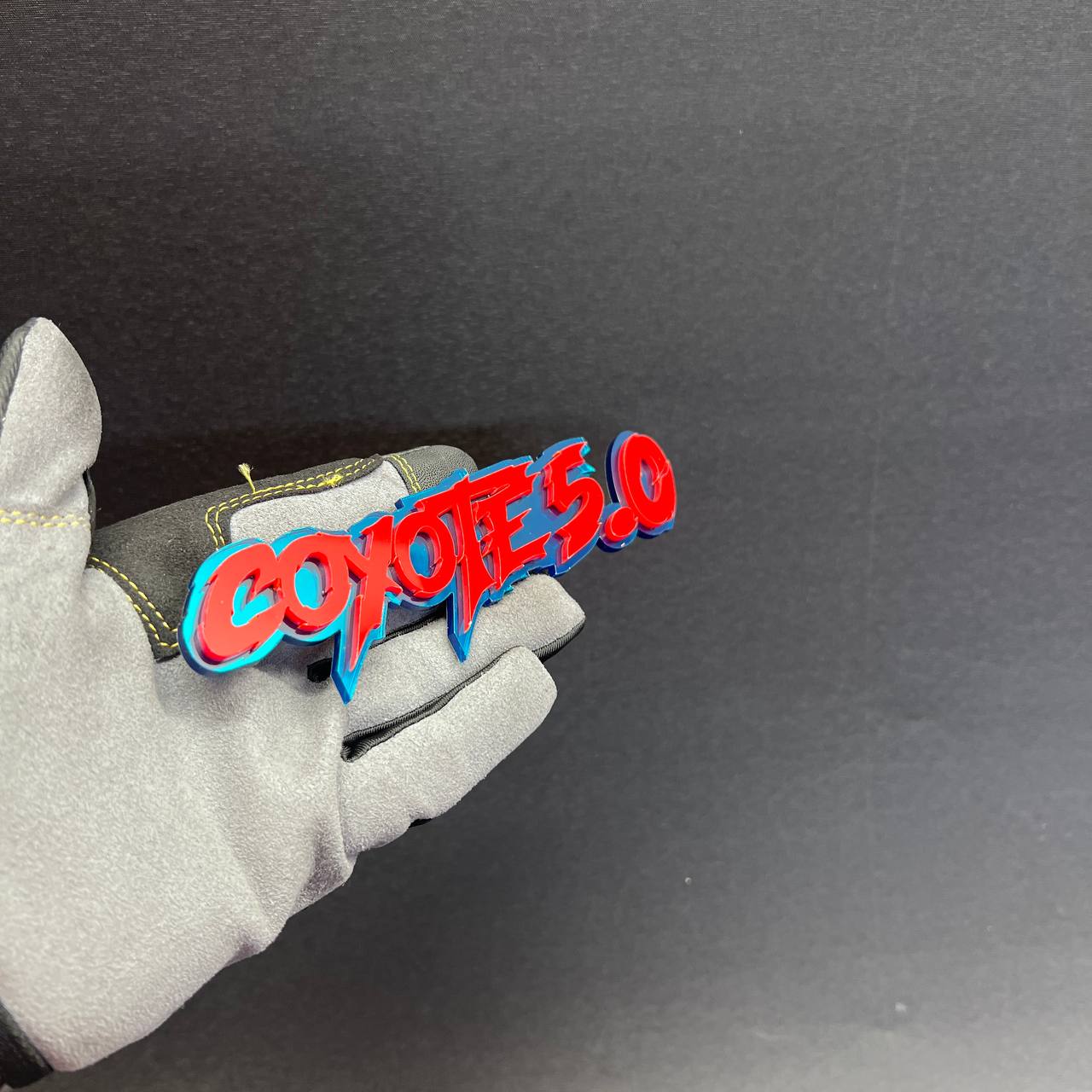 Red and blue Coyote 5.0 performance style car badge with 3M adhesive backing