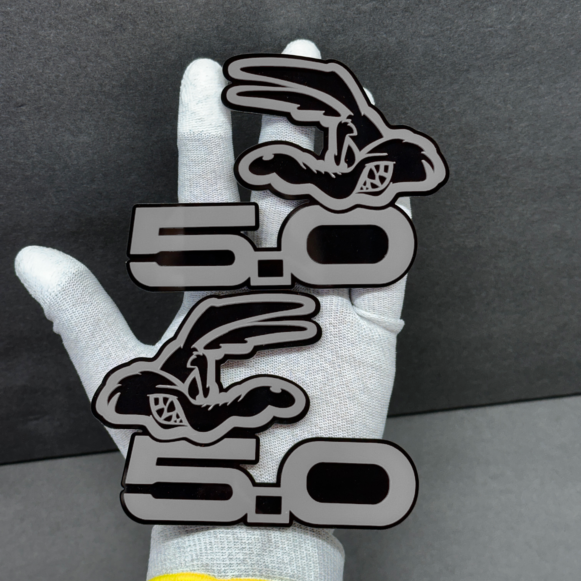 Coyote 5.0 car emblem badge – gray acrylic top layer with black base