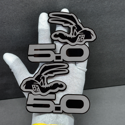 Coyote 5.0 car emblem badge – gray acrylic top layer with black base