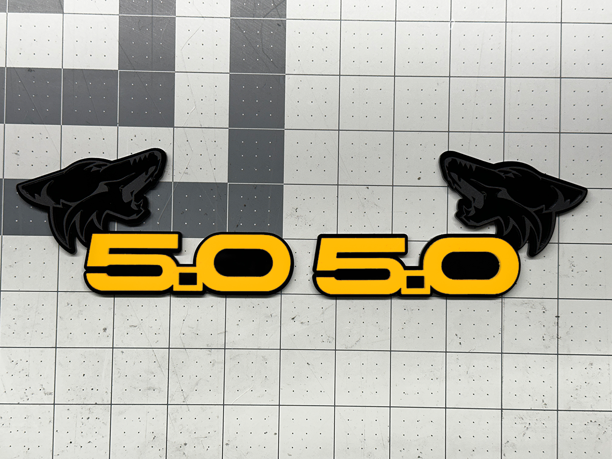 Coyote 5.0 emblem matte black with yellow top layer