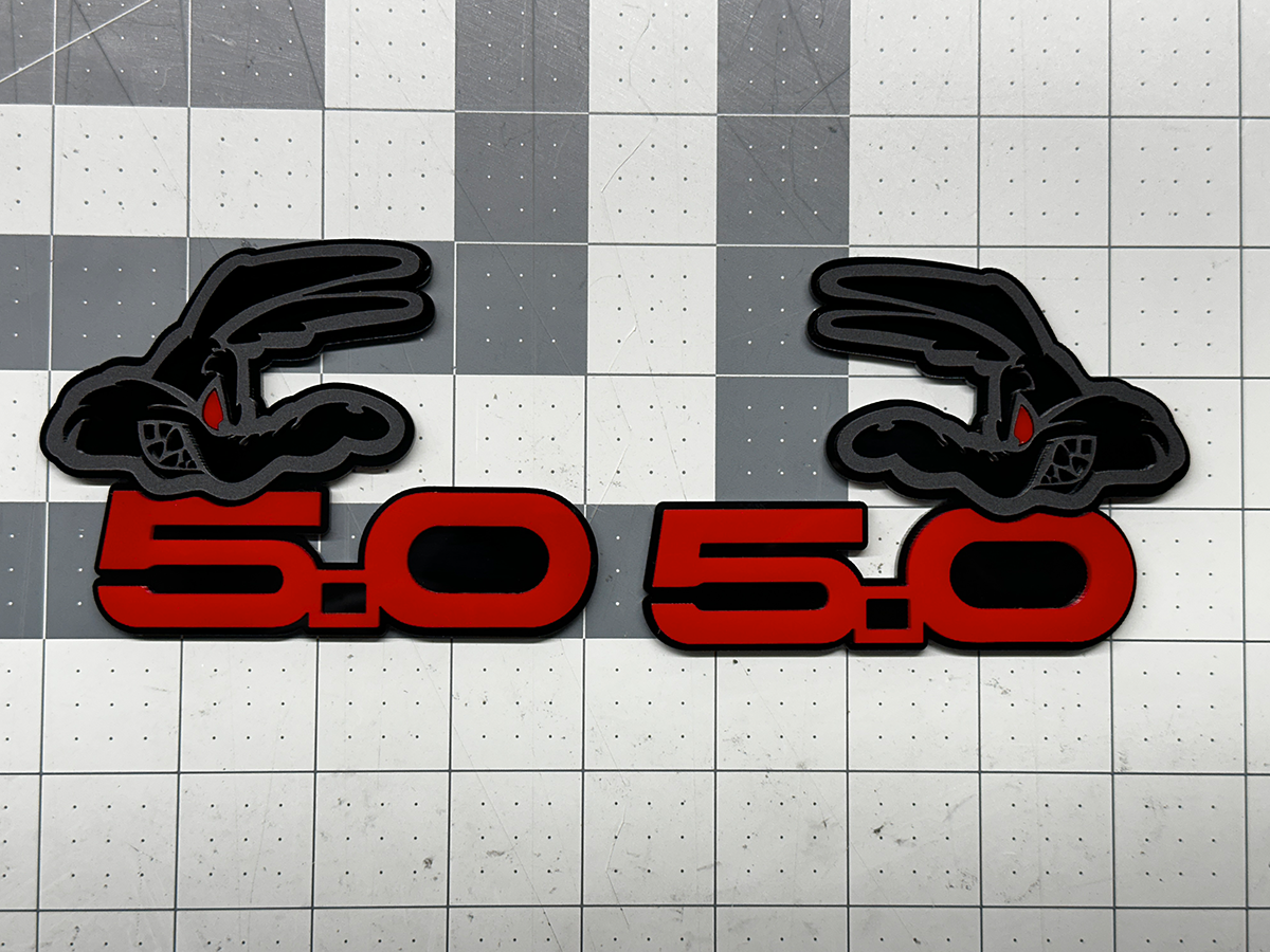 Coyote 5.0 emblem matte black with red top layer