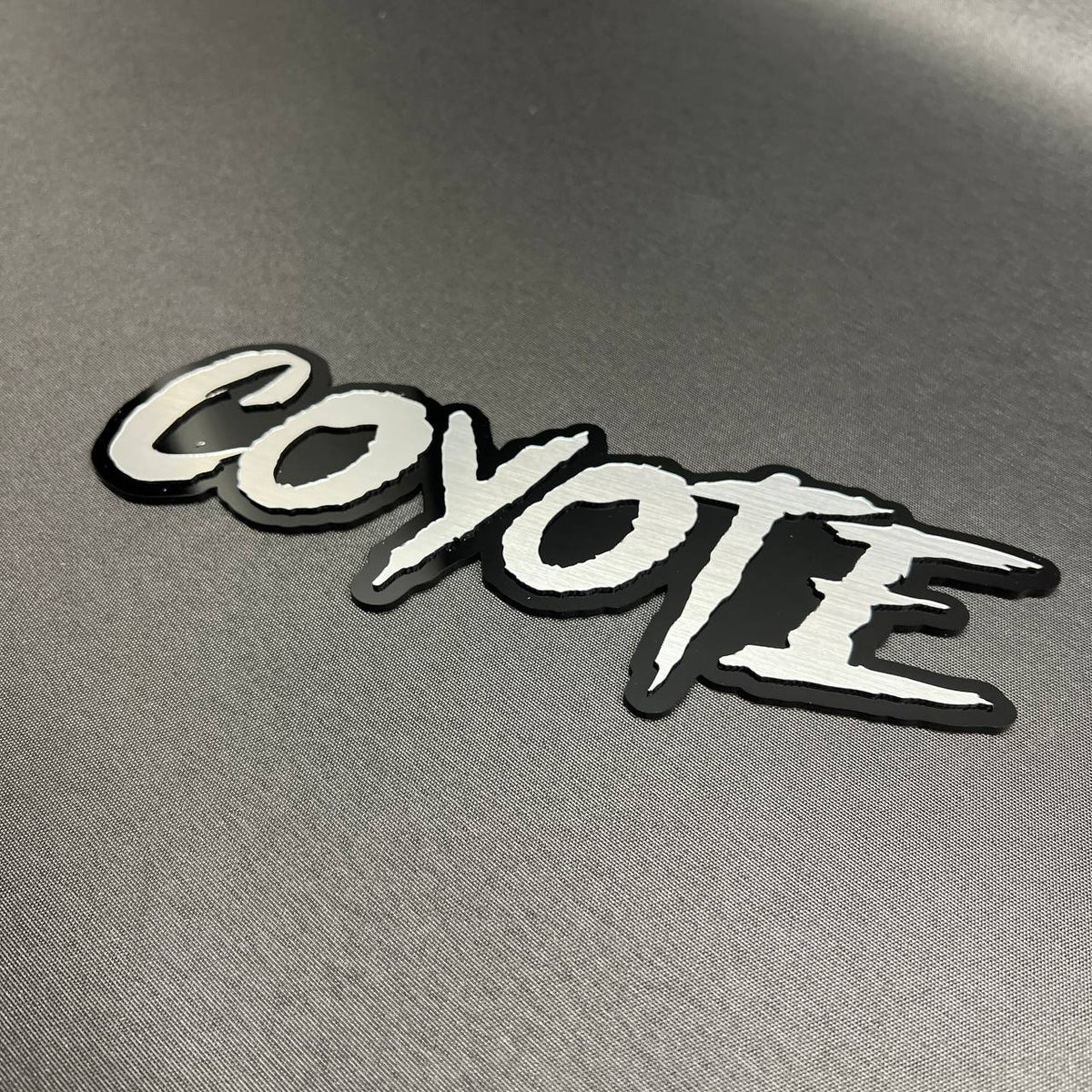COYOTE automotive badge red lettering black background custom car emblem