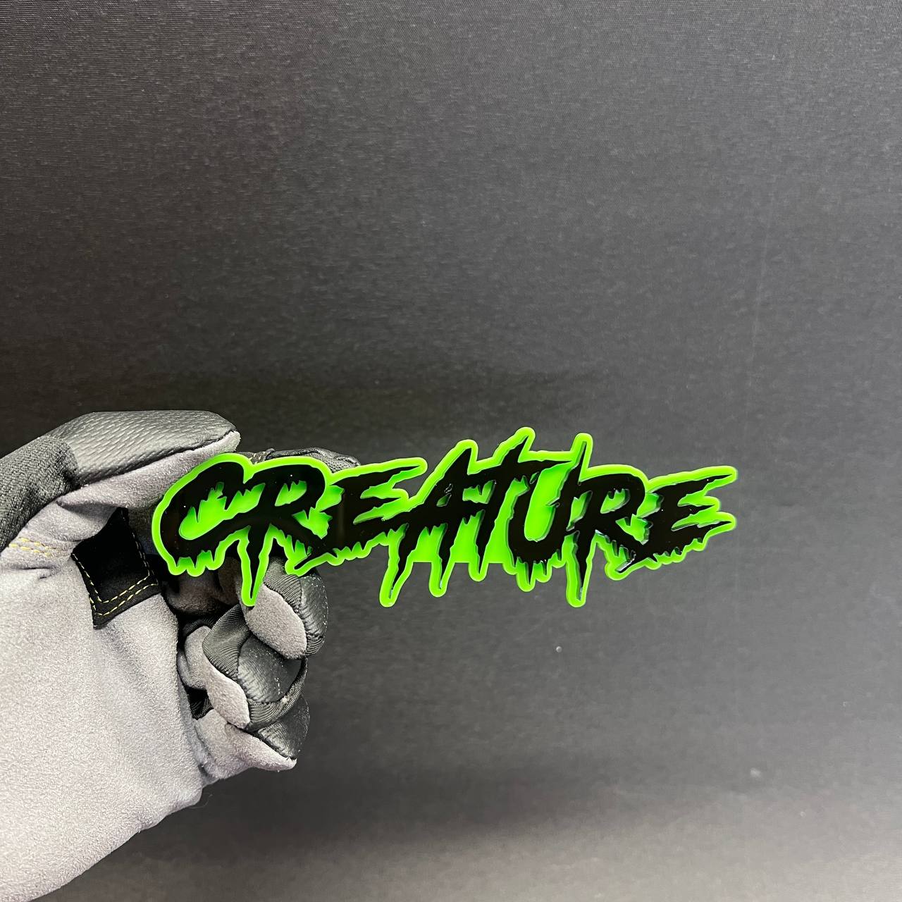 CREATURE car badge fender emblem with drip font design