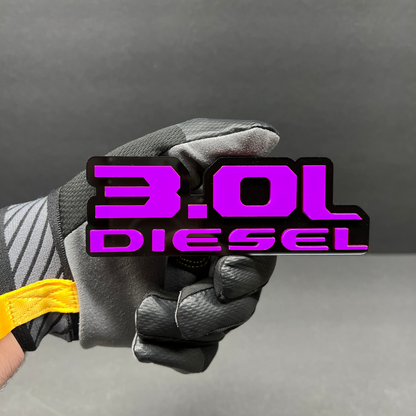 custom 3.0L diesel badge on Nissan Titan SUV