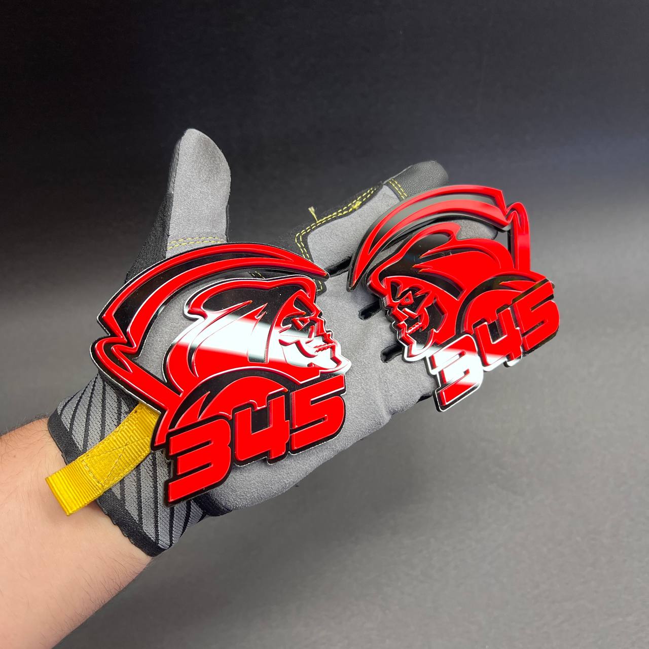 345 Reaper automotive emblem with black base and red face