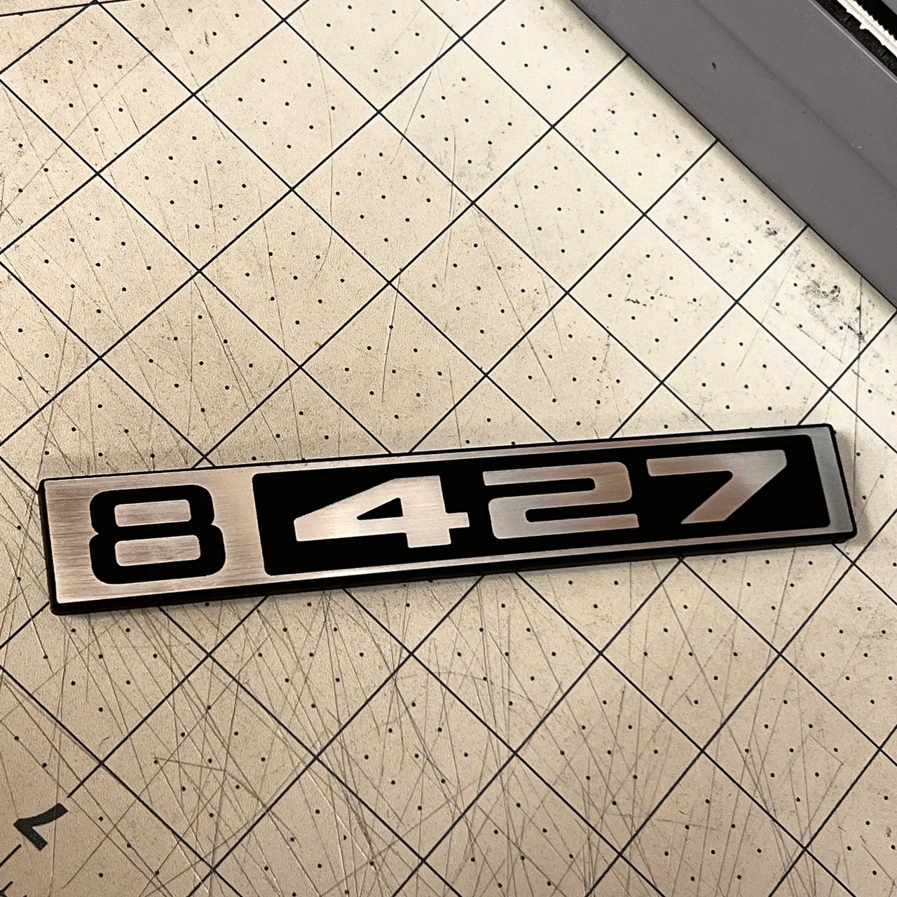 Classic Chevy C10 B 427 silver billet emblem for custom truck exterior styling.